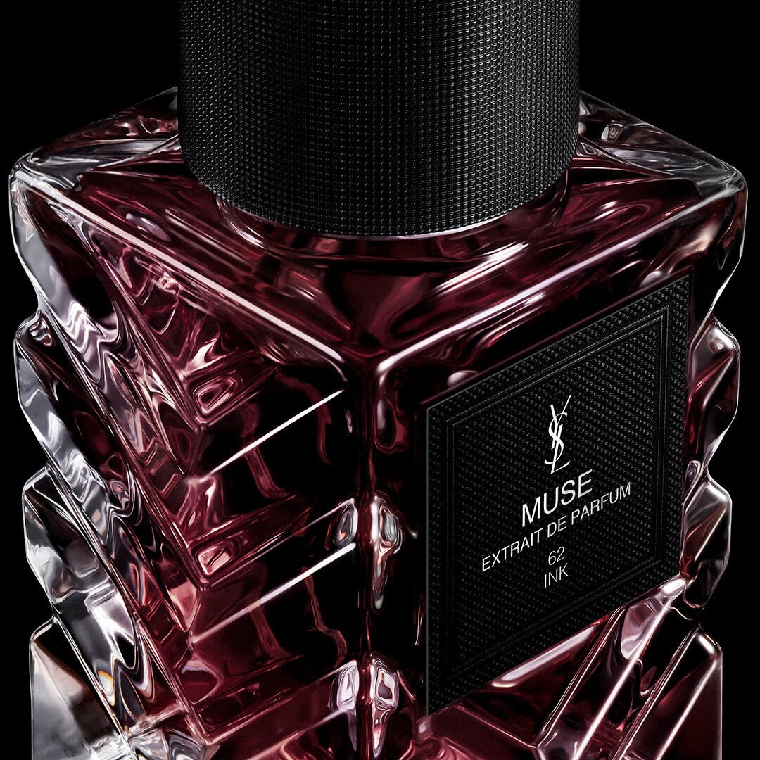 YSL Le Vestiaire des Parfums extrait de parfum bottles Tuxedo, Muse, and Blouse on reflective black surface.