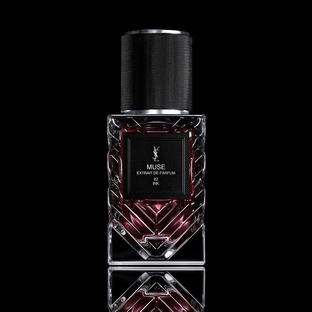 YSL Muse extrait de parfum bottle on black background with mirrored reflection.