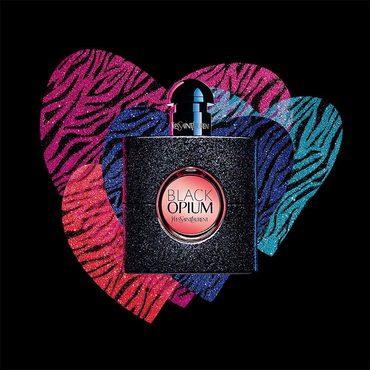 YSL Black Opium perfume bottle with vibrant zebra heart background