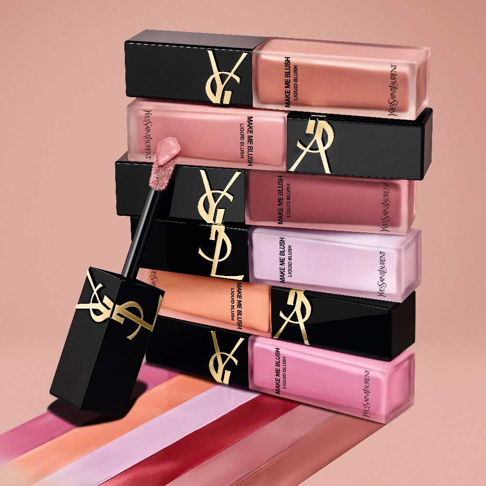 Stack of YSL Make Me Blush Liquid Blush bottles in various shades, highlighting the luxurious packaging and color range
