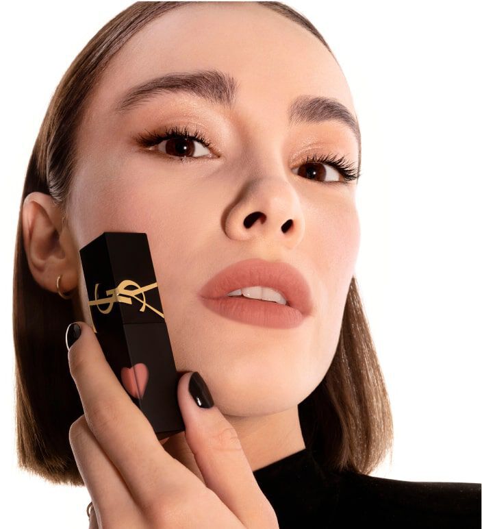 Model showcasing YSL The Inks Blur matte lip tint in soft nude shade 231 Rosewood Emotion