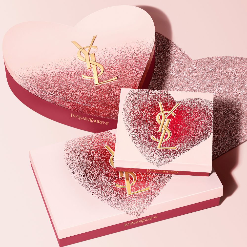 YSL Beauty Valentine's day gift sets in various sizes, featuring a glittery red heart design with the gold YSL logo.