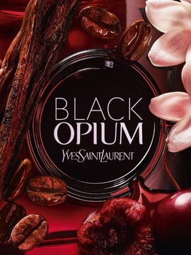 Close-up of YSL Black Opium Over Red logo with coffee beans, cherry, and vanilla accents
