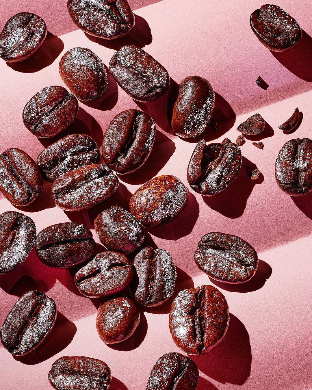 Rich roasted coffee beans symbolizing the bold coffee accord in YSL Black Opium Glitter.