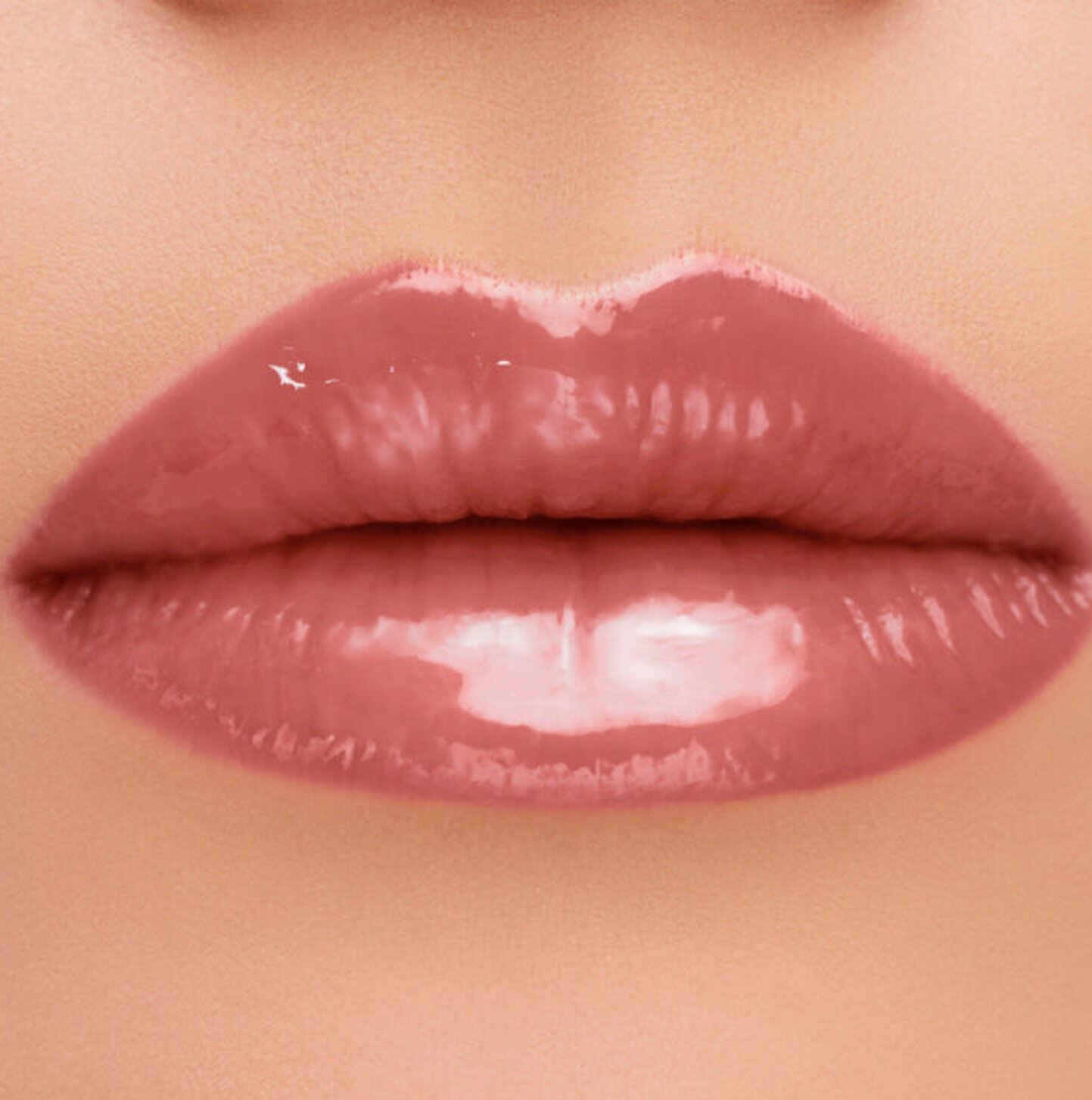 Close-up of lips wearing YSL The Inks Vinyl Cream lip stain in four shades