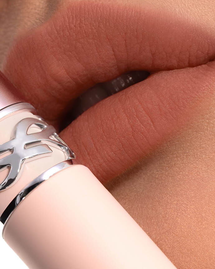 Mei J wearing YSL LOVENUDE Lip Blusher, shade 2, on fair skin. Portrait close-up.