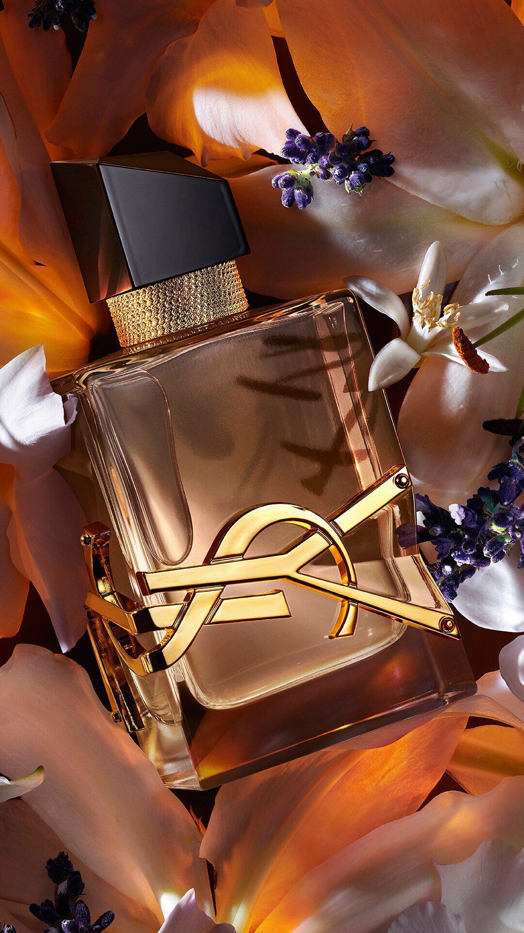 Libre Flowers & Flames bottle with gold YSL logo and floral-toned juice.