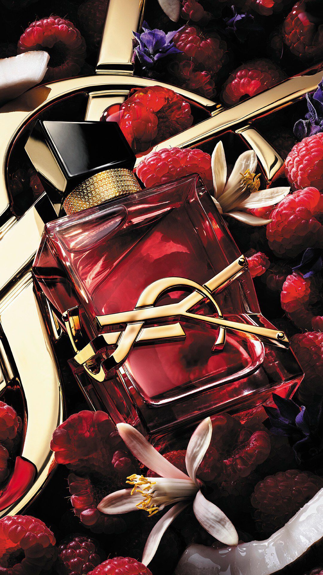Libre Berry Crush bottle with gold YSL logo and deep red juice.