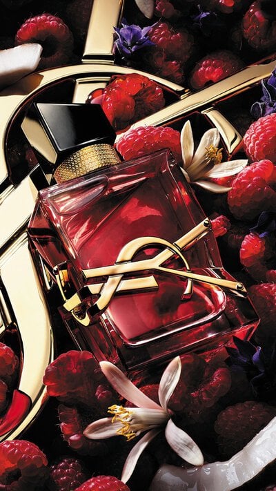 Libre Berry Crush bottle with gold YSL logo and deep red juice.