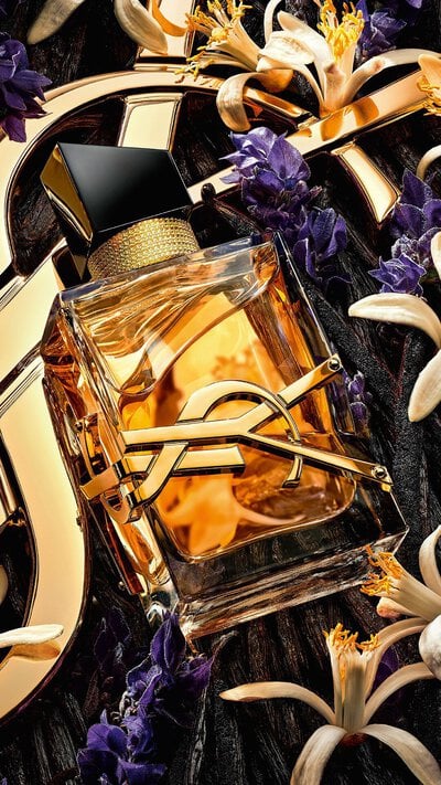 Libre Eau de Parfum Intense bottle with gold YSL logo and metallic platinum finish.
