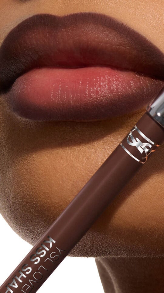 Bineta's lips with YSL LOVENUDE Kiss Shaper in Shade 110, a close-up showcasing the product.
