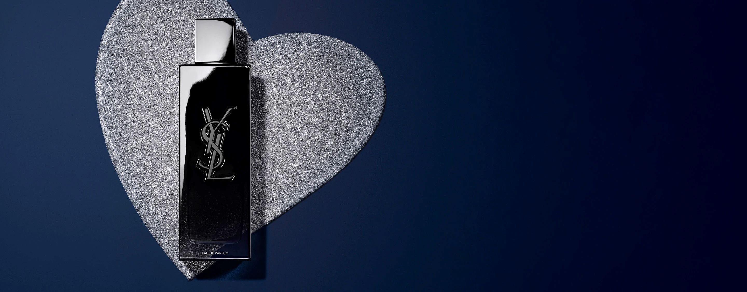 YSL MYSLF Eau de Parfum 100ml bottle, black with embossed YSL logo, on a glittery silver heart background.