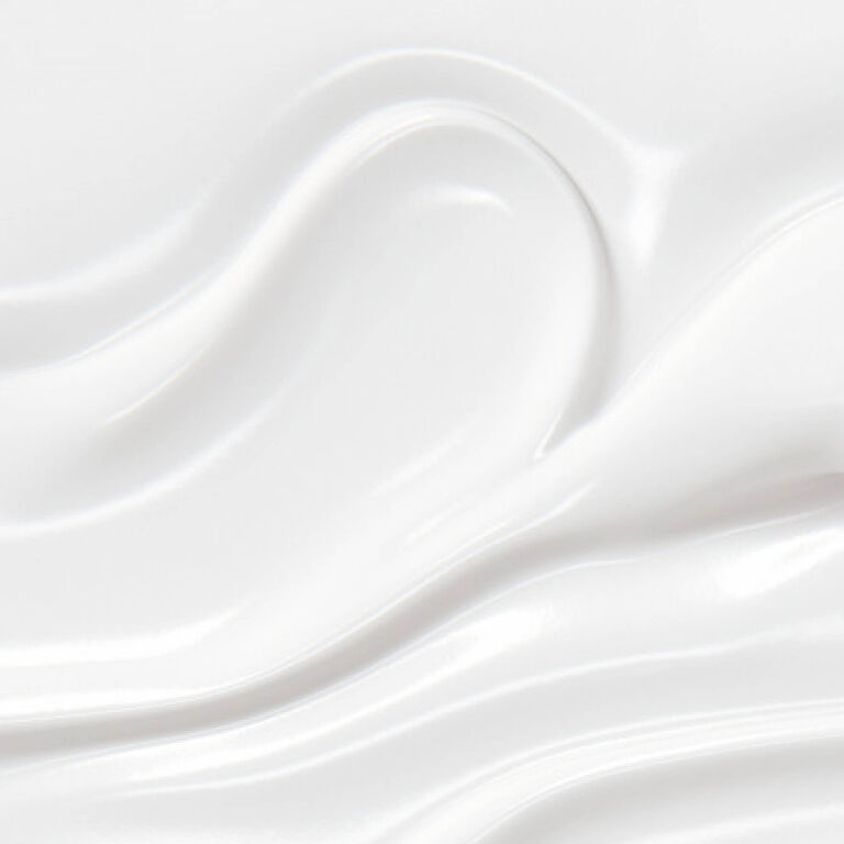 YSL Pure Shots Eye Reboot Cream, a close-up of its smooth, luxurious white texture, emphasizing its richness.