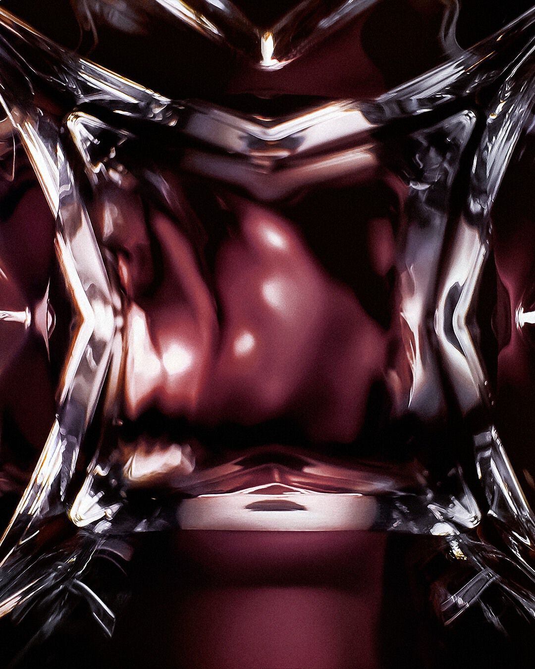 YSL LVDP Muse Extrait de Parfum 50ml bottle, close-up of faceted glass base with deep red fragrance inside.