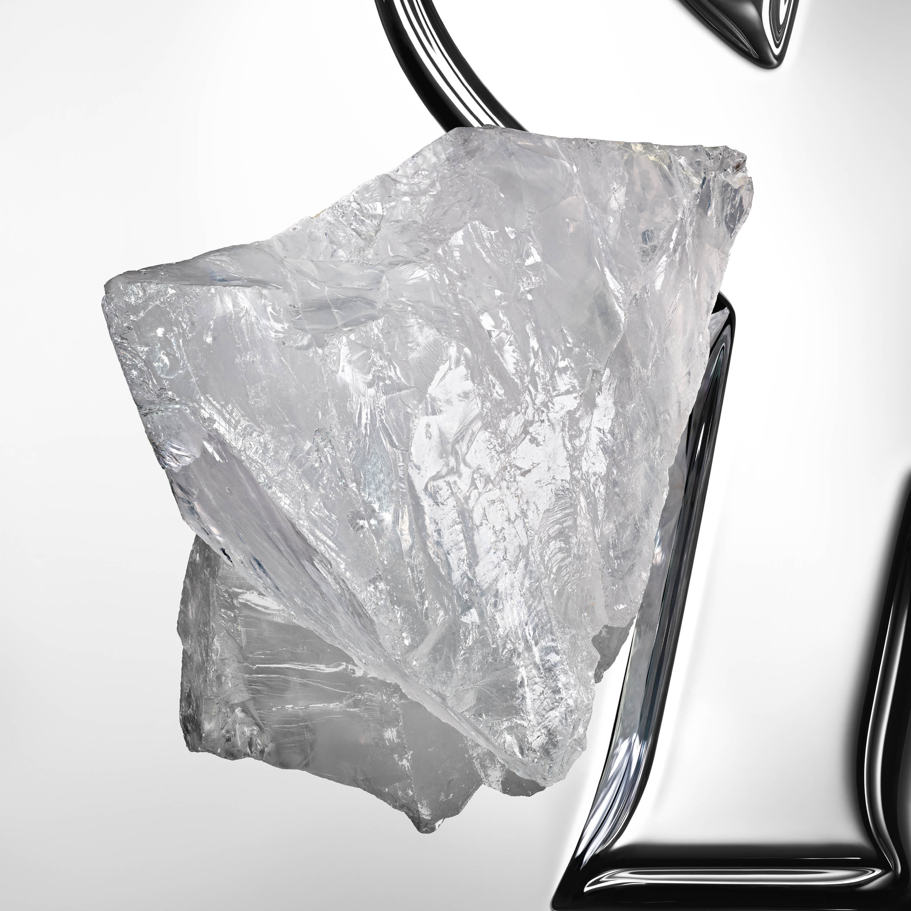 Compelling white musk crystal block on a reflective YSL Cassandre background.