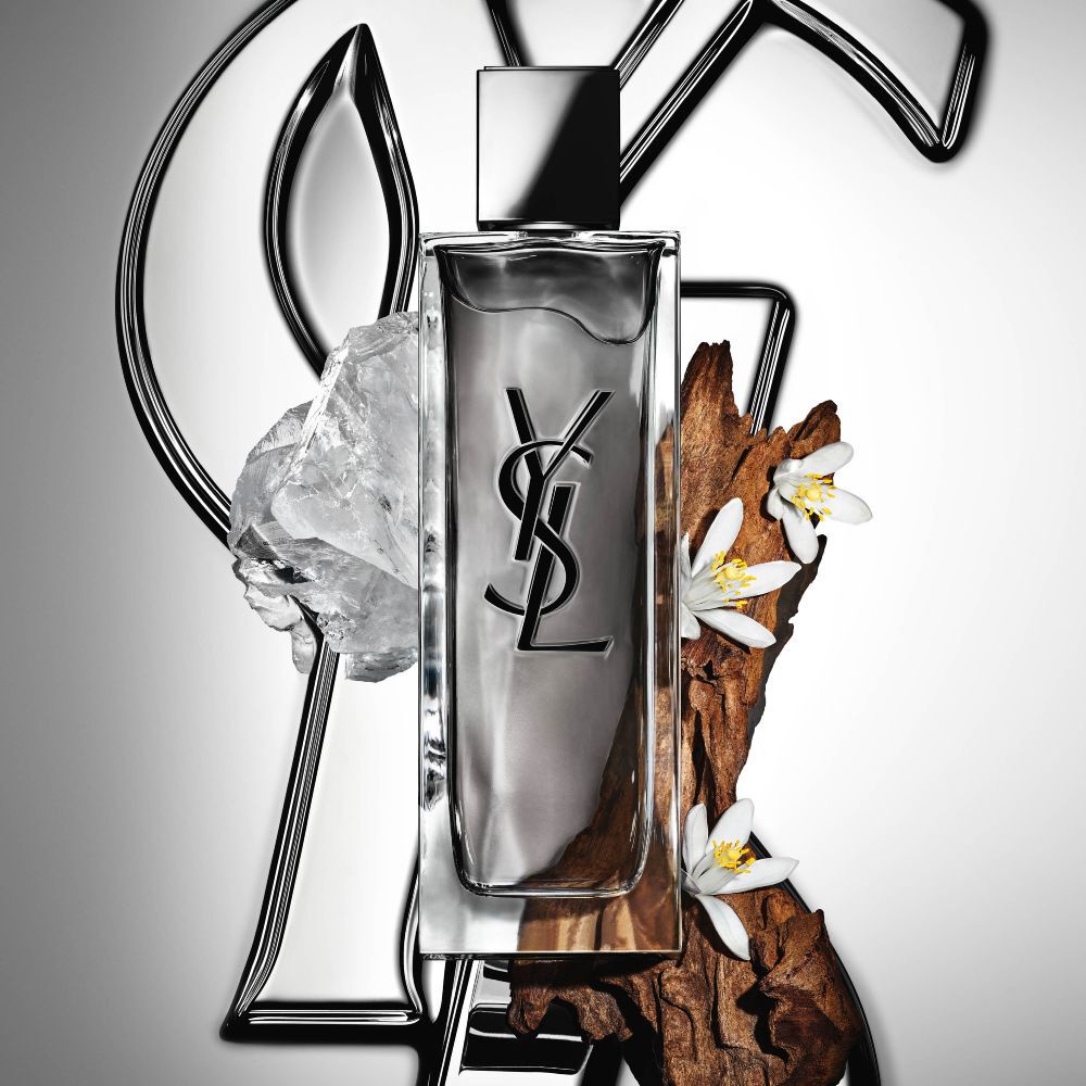 MYSLF Eau de Toilette Intense bottle by YSL Beauty surrounded by orange blossom, woods and white musk.