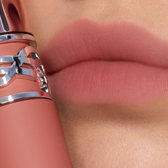 Macro close-up of soft-blurred, nude pink
lips.