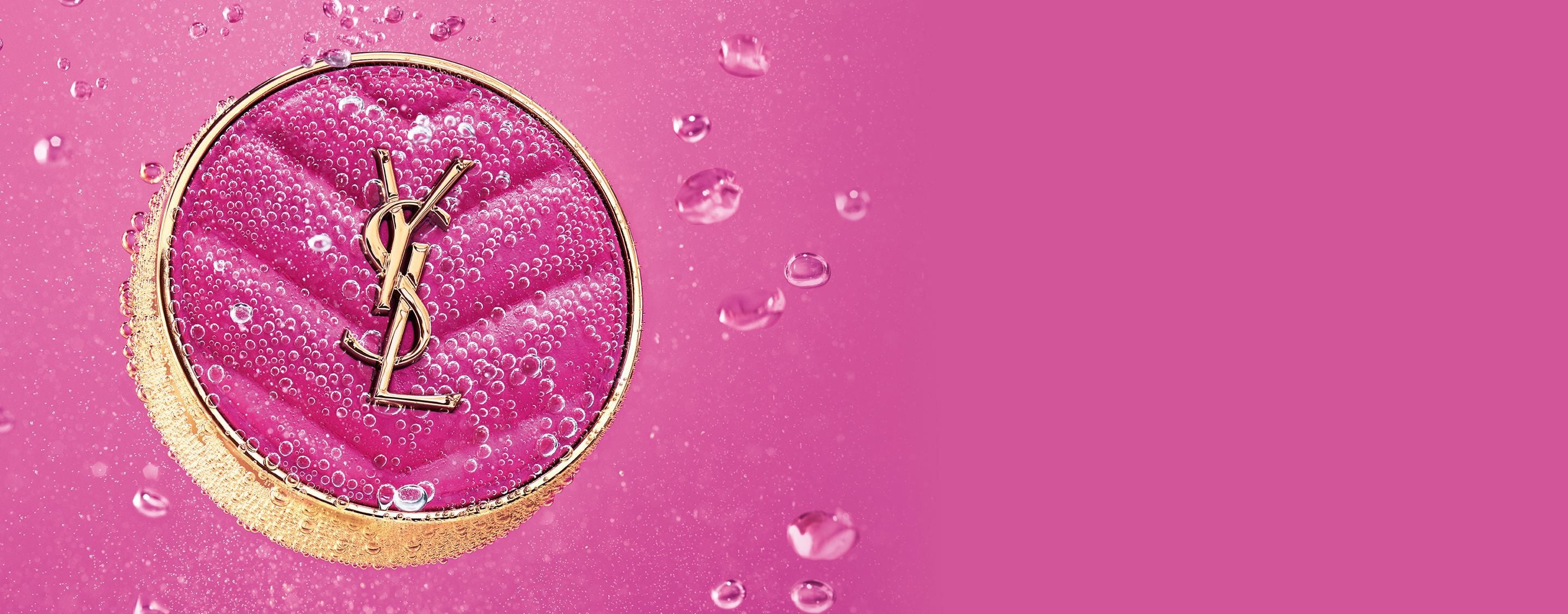 YSL Make Me Blush Powder Blush in shade 66 Fuchsia Fizz, immersed
in water with bubbles on a vibrant pink background.