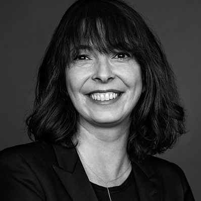 black and white photo of a woman smiling