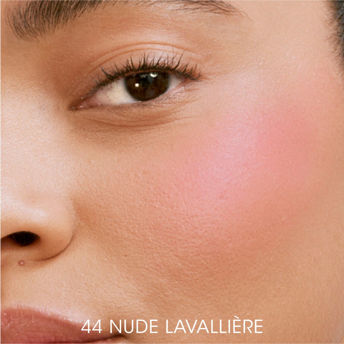 Close-up of model wearing YSL Liquid Blush in shade 44 Nude Lavallière for a radiant, dewy glow